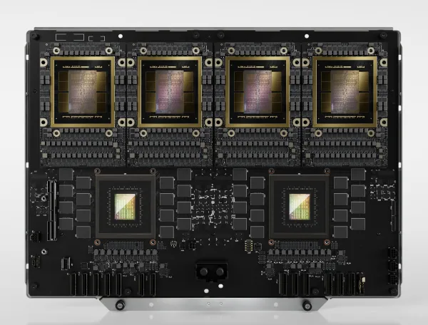 GB200 compute tray showing four Blackwell GPU packages and two Grace CPUs on one board